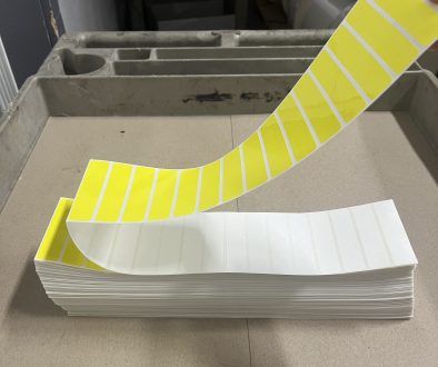 Sheet of perforated labels arranged in a uniform grid with clean tear lines.