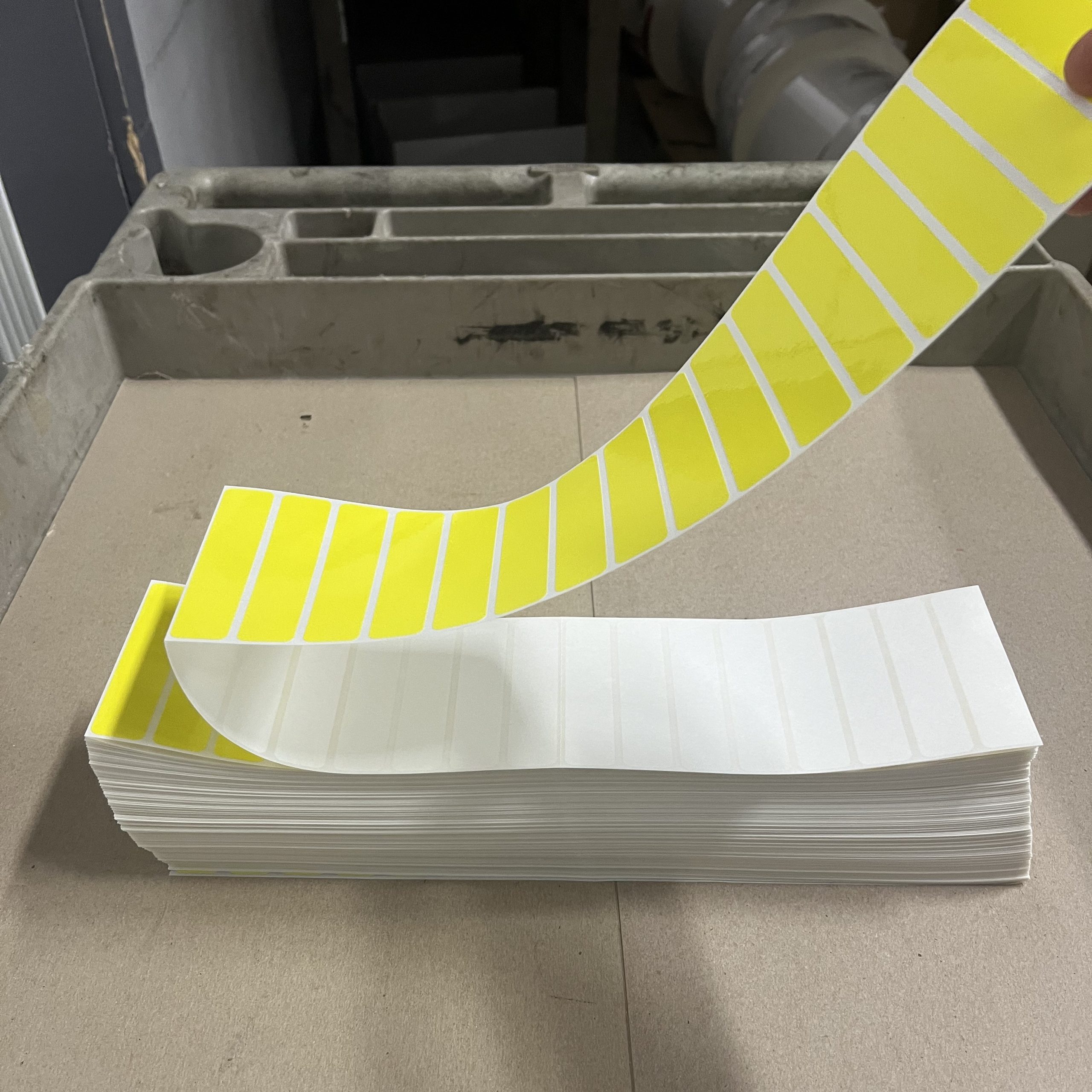 Sheet of perforated labels arranged in a uniform grid with clean tear lines.