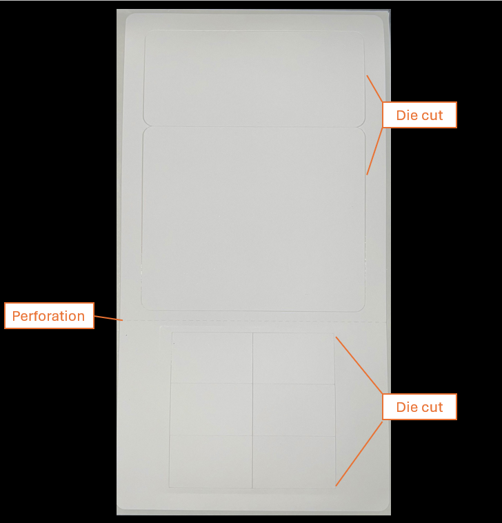 Perforated white adhesive labels arranged in a grid, showing evenly spaced tear‑off sections.